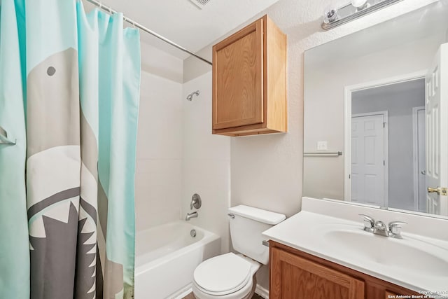 full bathroom featuring shower / tub combo with curtain, vanity, and toilet