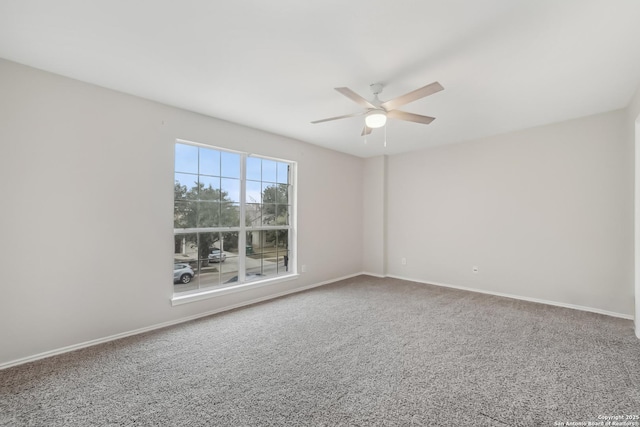 carpeted empty room with ceiling fan