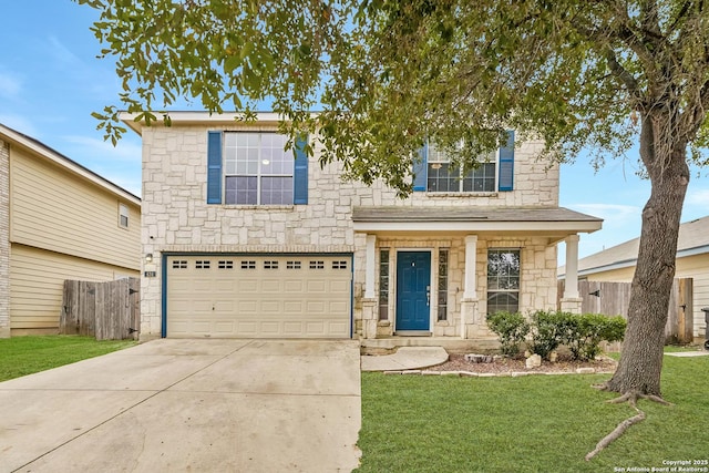 view of front of house featuring a garage and a front lawn