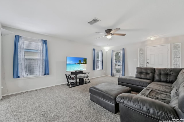 living room featuring ceiling fan and carpet floors