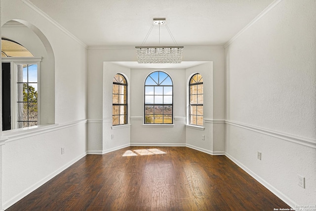 unfurnished dining area with dark hardwood / wood-style flooring and ornamental molding