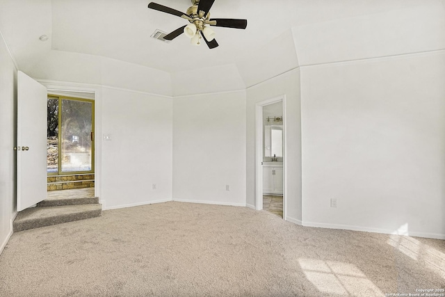 carpeted empty room featuring ceiling fan