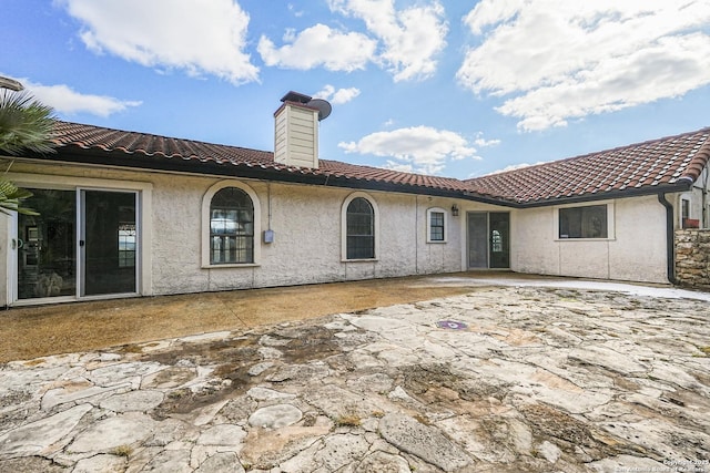 back of house featuring a patio