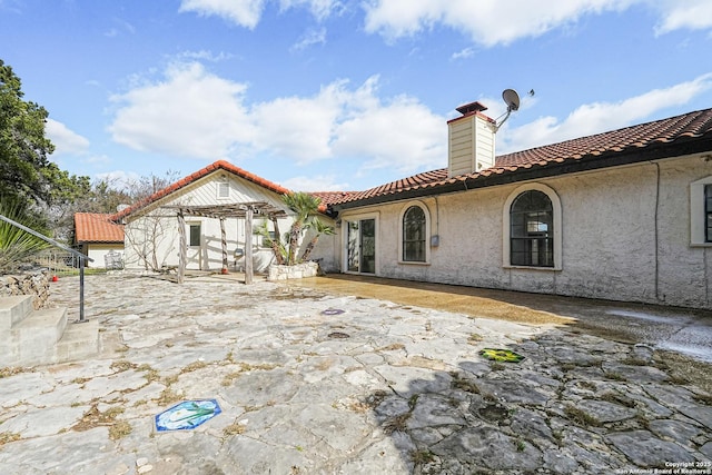 back of house featuring a patio area