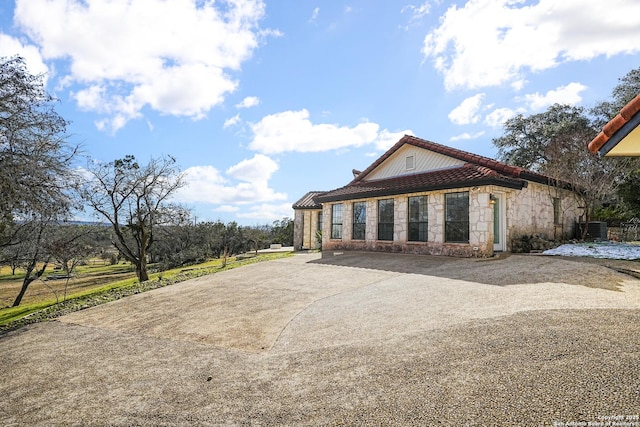 view of side of property featuring cooling unit