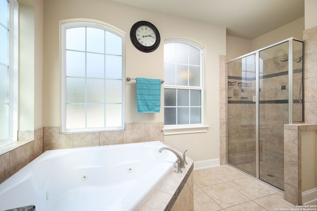 bathroom featuring shower with separate bathtub and tile patterned flooring