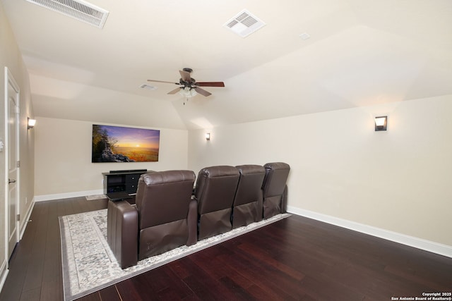 cinema featuring vaulted ceiling, dark hardwood / wood-style floors, and ceiling fan