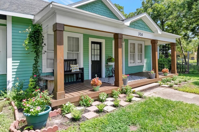 entrance to property featuring a porch