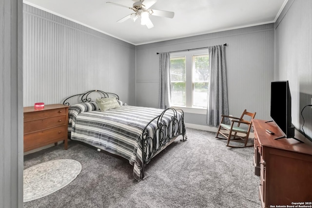 carpeted bedroom featuring crown molding and ceiling fan