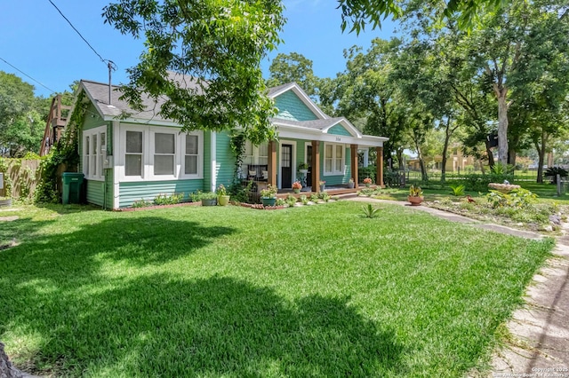 view of front of home with a front lawn and covered porch