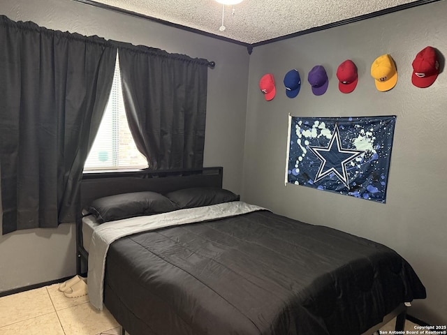 tiled bedroom featuring crown molding and a textured ceiling