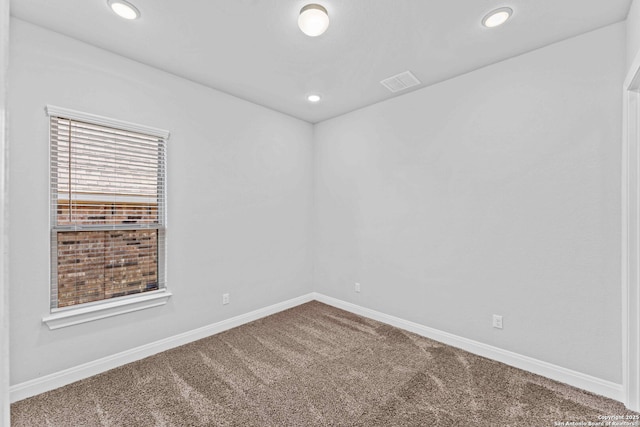 unfurnished room featuring carpet flooring