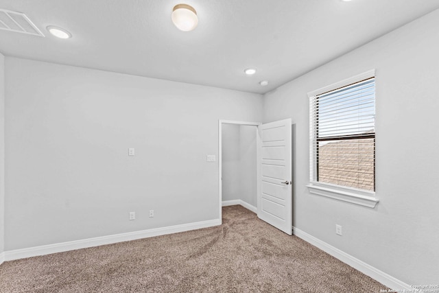 unfurnished bedroom with carpet floors