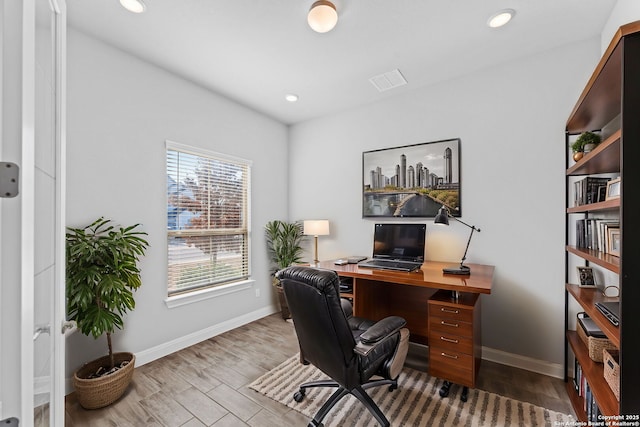 home office featuring light hardwood / wood-style floors