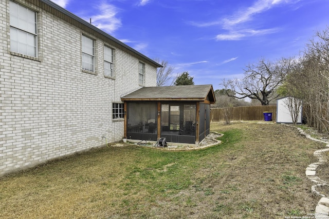 view of yard featuring a sunroom