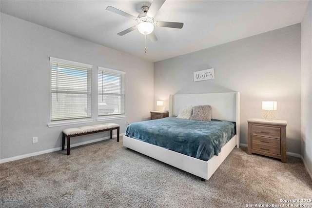 bedroom featuring ceiling fan and carpet