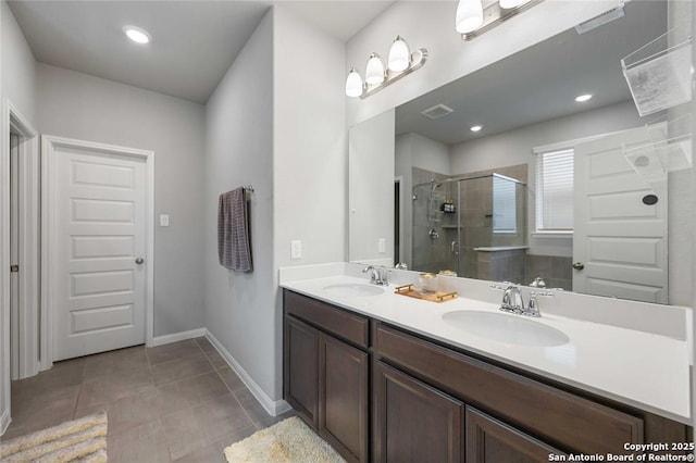 bathroom with vanity, tile patterned floors, and walk in shower