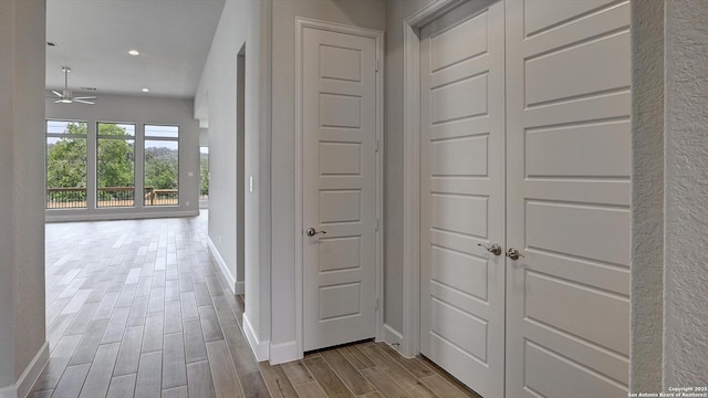 109 Barton Crk, Boerne, TX 78006 - corridor with wood finished floors, baseboards, and recessed lighting
