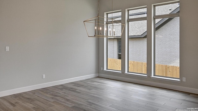 109 Barton Crk, Boerne, TX 78006 - unfurnished dining area with healthy amount of natural light, wood finished floors, and baseboards