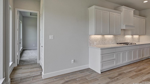 109 Barton Crk, Boerne, TX 78006 - kitchen with light wood finished floors, light countertops, baseboards, and recessed lighting