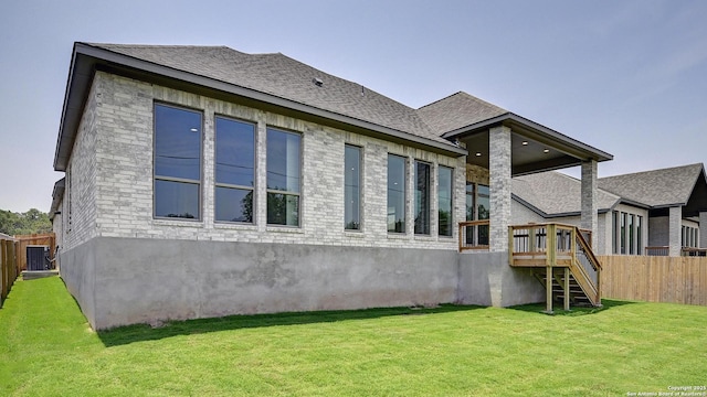 109 Barton Crk, Boerne, TX 78006 - rear view of house with stairs, a wooden deck, central AC unit, and roof with shingles