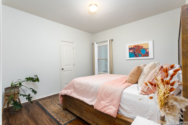 bedroom featuring dark wood-type flooring