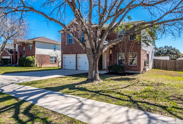 view of front of home with a garage and a front yard