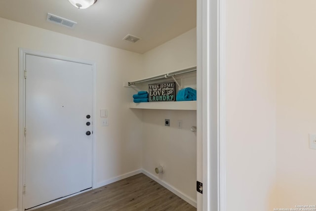 laundry room featuring hookup for an electric dryer and hardwood / wood-style floors