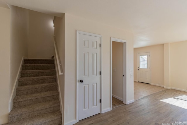 staircase with wood-type flooring