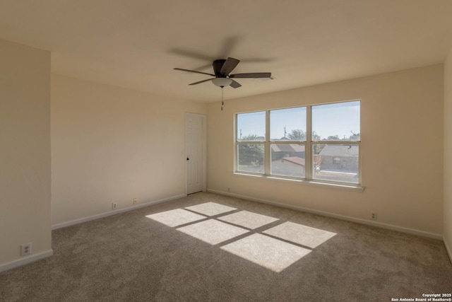 carpeted empty room with ceiling fan