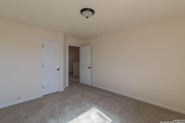 empty room with light colored carpet