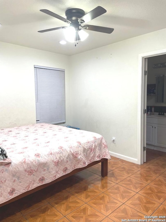 bedroom featuring sink, parquet flooring, and ceiling fan