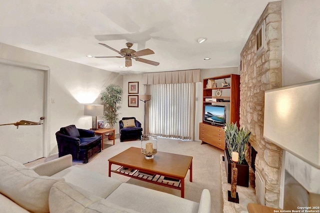 carpeted living room featuring ceiling fan