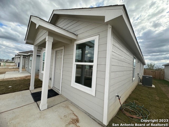 view of home's exterior featuring central AC unit and a patio