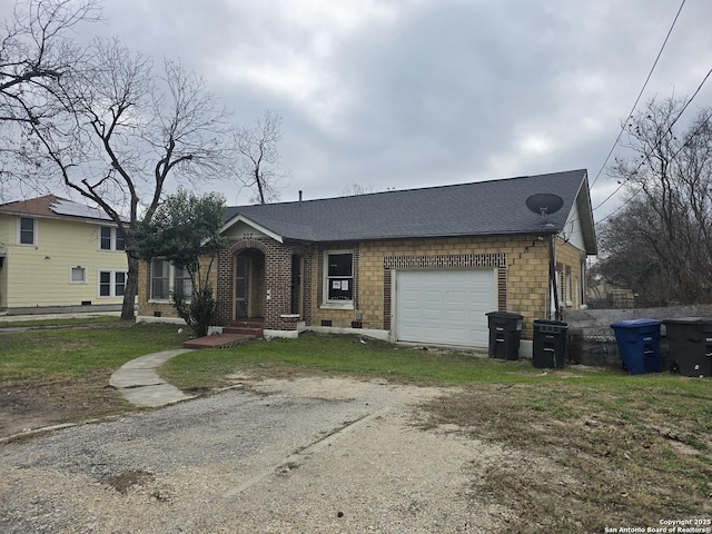 ranch-style home featuring a garage