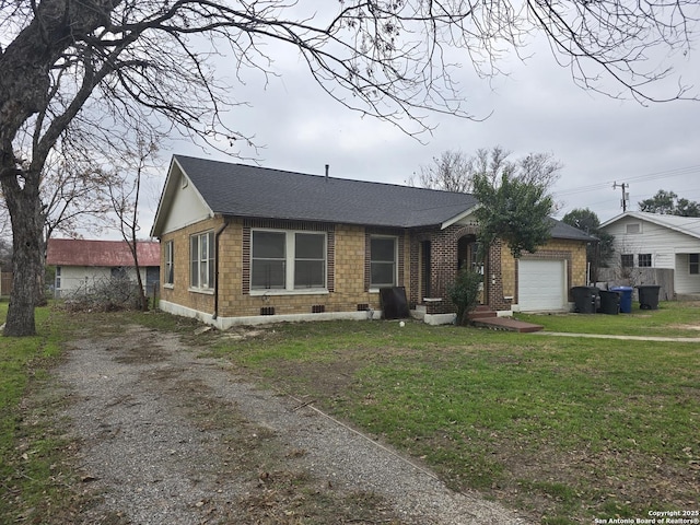 view of front of property with a garage and a front yard