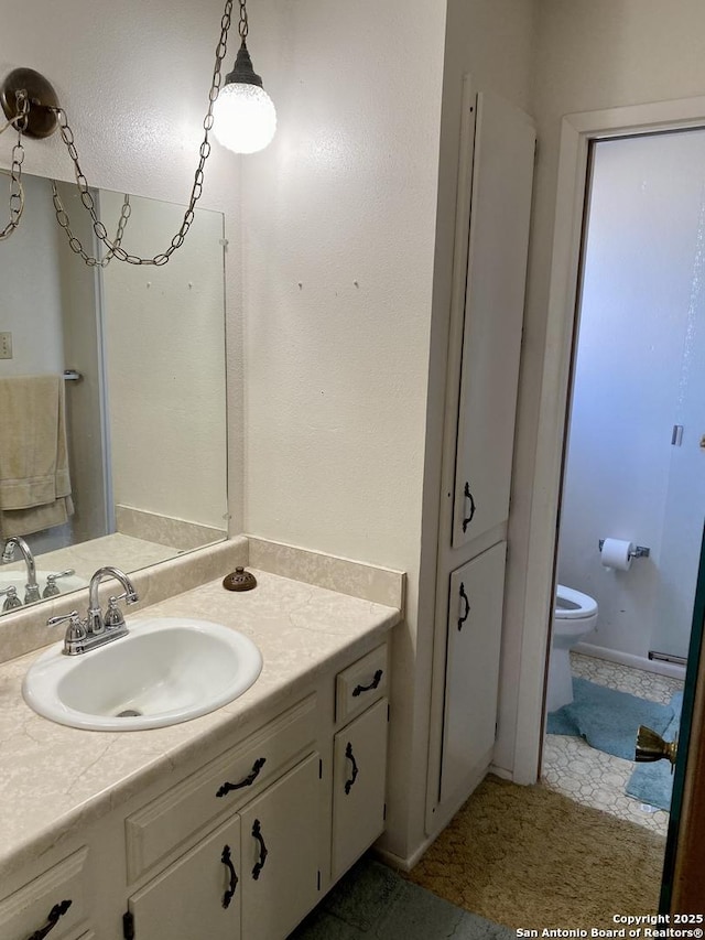 bathroom with vanity and toilet