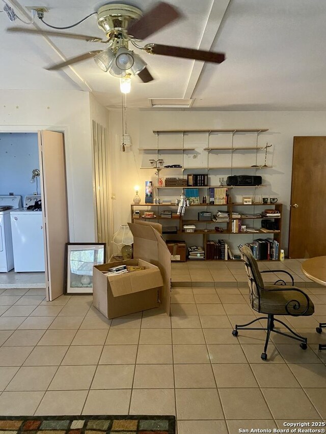 interior space featuring separate washer and dryer and ceiling fan