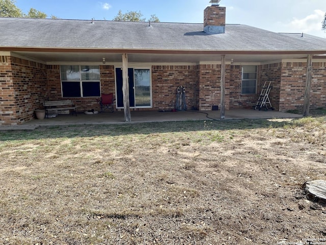 back of property featuring a patio area