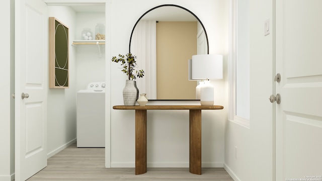 corridor featuring washer / dryer and light hardwood / wood-style flooring