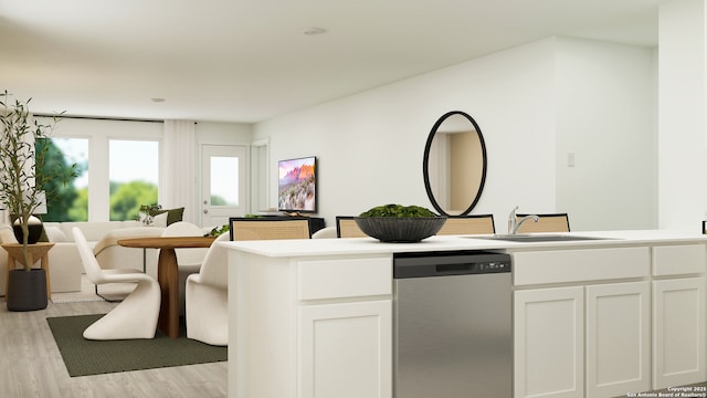 kitchen featuring dishwasher, sink, white cabinets, and light wood-type flooring