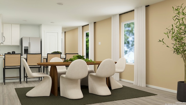 dining area featuring light wood-type flooring