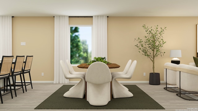 dining space with light wood-type flooring