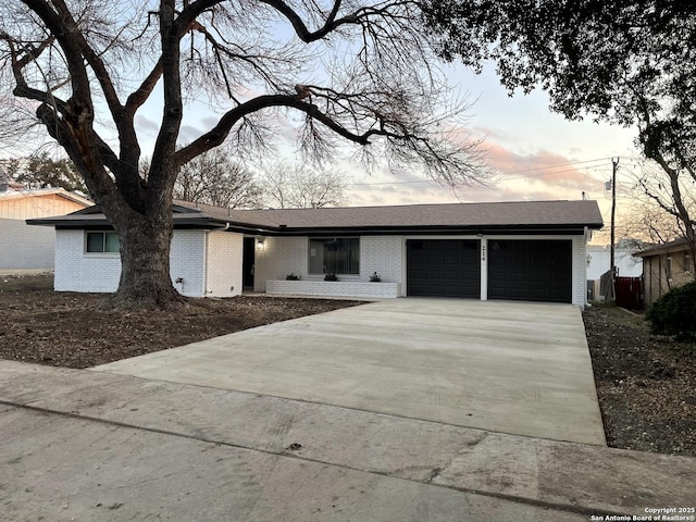 ranch-style home featuring a garage