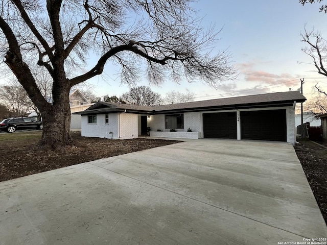 ranch-style home featuring a garage