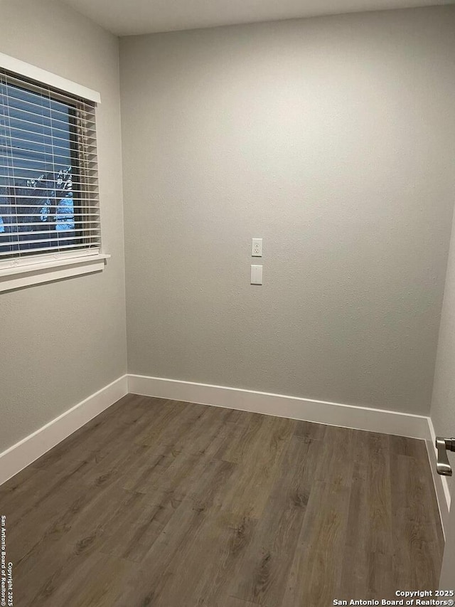 empty room featuring dark hardwood / wood-style floors