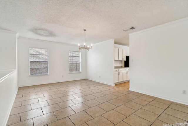 unfurnished room featuring an inviting chandelier, light tile patterned floors, crown molding, and a textured ceiling