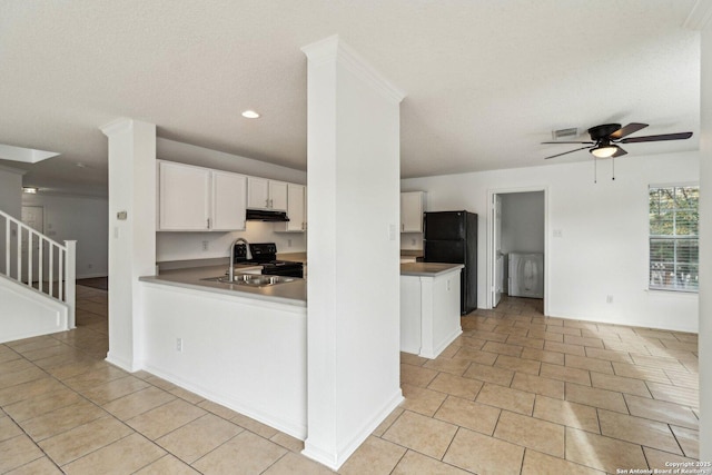 kitchen with sink, ceiling fan, white cabinetry, range with electric cooktop, and black fridge