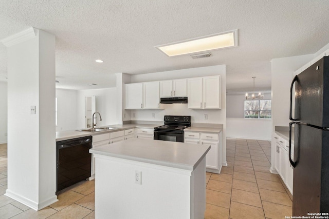 kitchen featuring black appliances, sink, white cabinets, hanging light fixtures, and kitchen peninsula