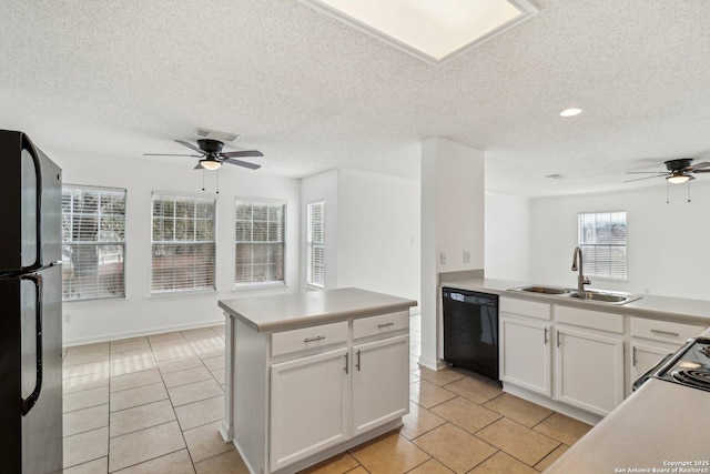 kitchen featuring white cabinetry, sink, dishwasher, and refrigerator